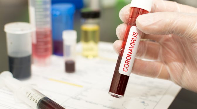 Concept to represent the 2020 virus threat Coronavirus, blood in a test tube.